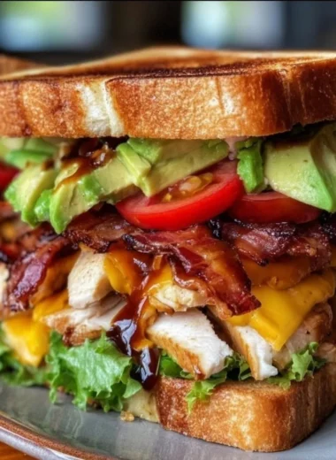 Delicious Cowboy Club Sandwich with layers of turkey, ham, bacon, and fresh veggies