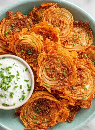 Crispy onion ring chips served in a bowl for a delicious snack.