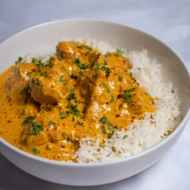 Bowl of easy and healthy coconut chicken curry with vegetables and rice