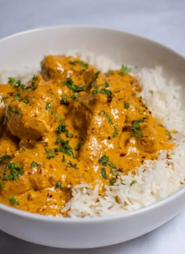 Bowl of easy and healthy coconut chicken curry with vegetables and rice