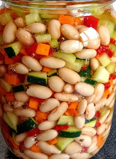 A variety of fermented beans served in a bowl, highlighting their unique textures and colors.