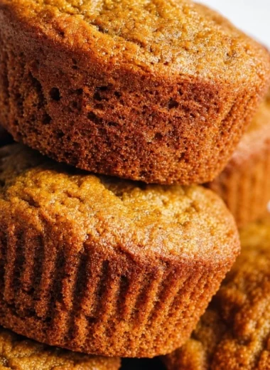 Gluten Free Paleo Pumpkin Protein Muffins in a rustic setting