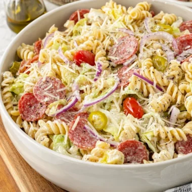 Colorful Grinder Pasta Salad with vegetables and dressing in a bowl
