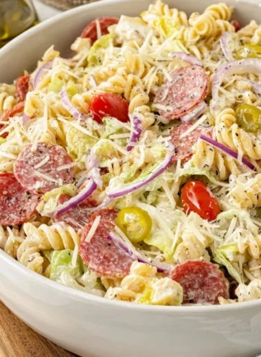 Colorful Grinder Pasta Salad with vegetables and dressing in a bowl