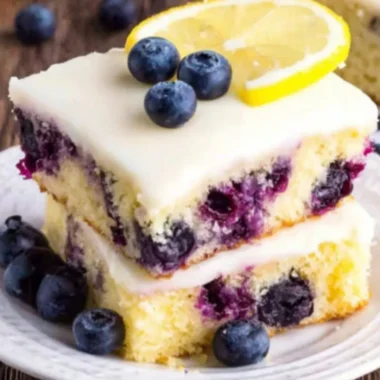 Delicious Lemon Blueberry Cake topped with fresh blueberries and lemon zest