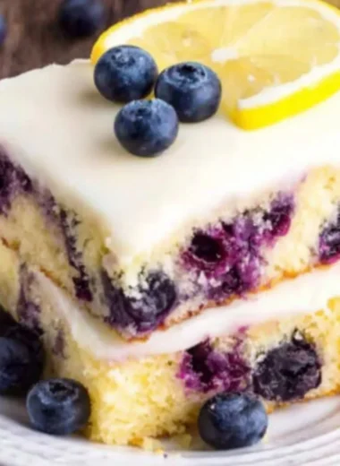 Delicious Lemon Blueberry Cake topped with fresh blueberries and lemon zest