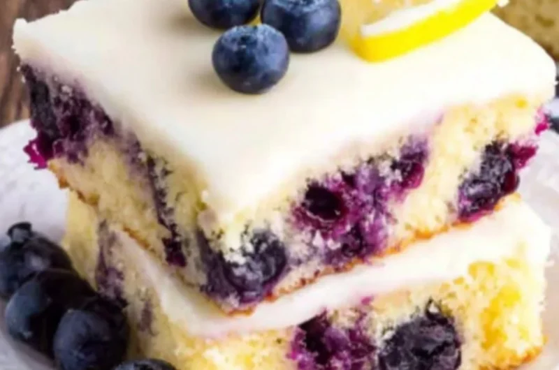 Delicious Lemon Blueberry Cake topped with fresh blueberries and lemon zest