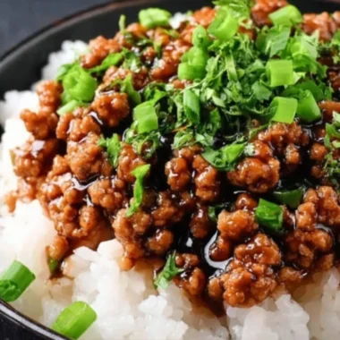 Plate of honey garlic ground turkey served with vegetables and rice