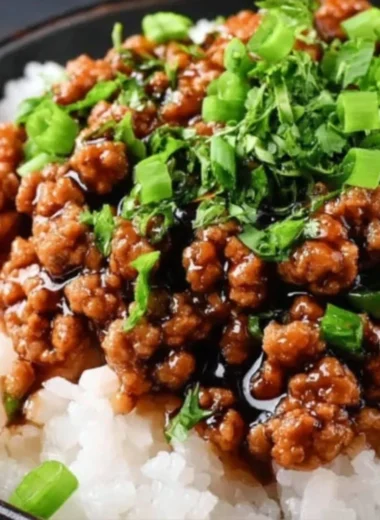 Plate of honey garlic ground turkey served with vegetables and rice