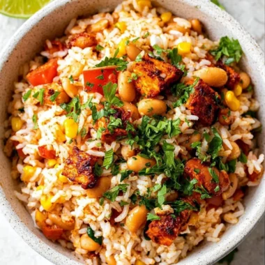Delicious Mediterranean Rice and Beans served in a bowl with fresh herbs.