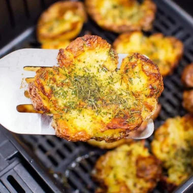 Crispy air fryer smashed potatoes seasoned and golden brown