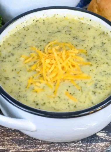 Delicious creamy zucchini soup served in a bowl with fresh garnishes