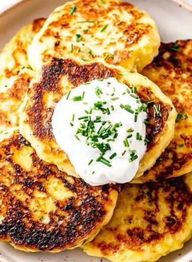 Golden-brown leftover mashed potato cakes served with dipping sauce