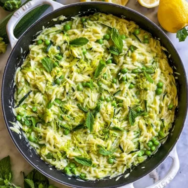 Plate of Lemon Orzo with Zucchini garnished with herbs