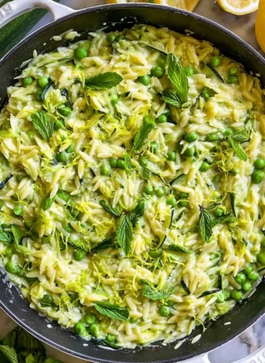 Plate of Lemon Orzo with Zucchini garnished with herbs