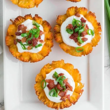 Delicious loaded tater tots with toppings, perfect for appetizers