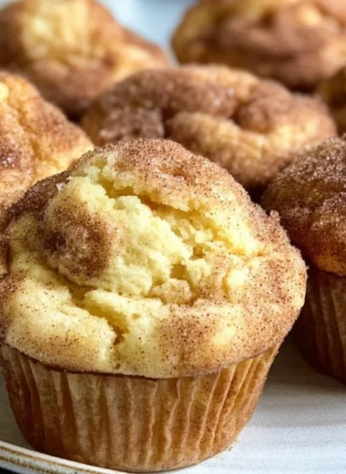 Freshly baked Snickerdoodle Muffins topped with cinnamon sugar