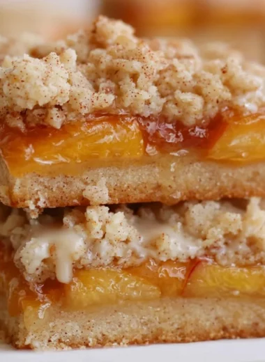 Delicious summery peach bars with fresh peaches and a golden crust