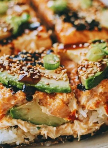 Baked Spicy Salmon Sushi Casserole dish with layer of salmon and rice