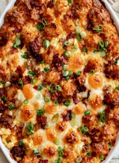 Delicious breakfast casserole topped with cheese and veggies