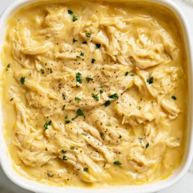 Delicious chicken and gravy served on a plate, perfect for comfort food lovers.