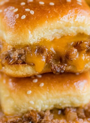 Delicious cheeseburger sliders on Hawaiian rolls, perfect for potlucks.