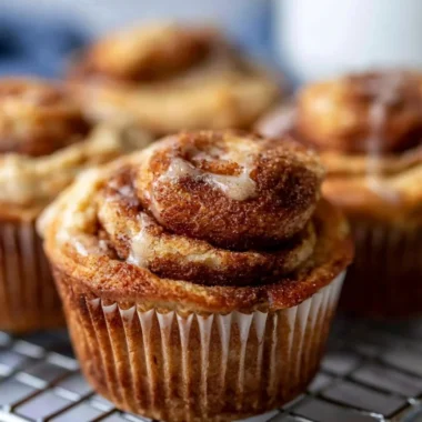 Easy cinnamon protein muffins fresh out of the oven on a cooling rack