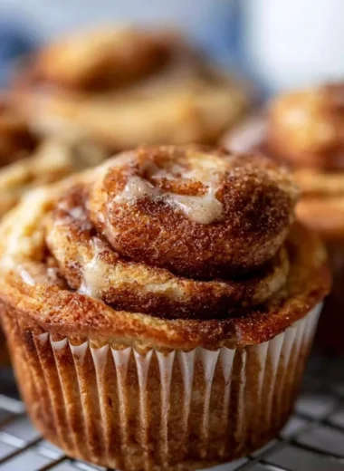 Easy cinnamon protein muffins fresh out of the oven on a cooling rack