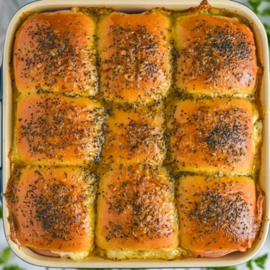 Tasty ham and cheese sliders on a platter, ideal for parties and gatherings.