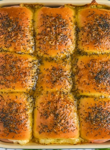 Tasty ham and cheese sliders on a platter, ideal for parties and gatherings.