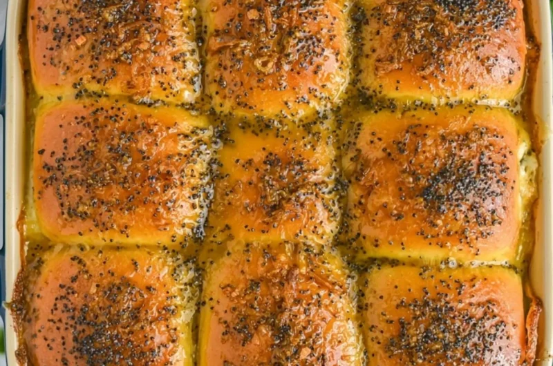 Tasty ham and cheese sliders on a platter, ideal for parties and gatherings.