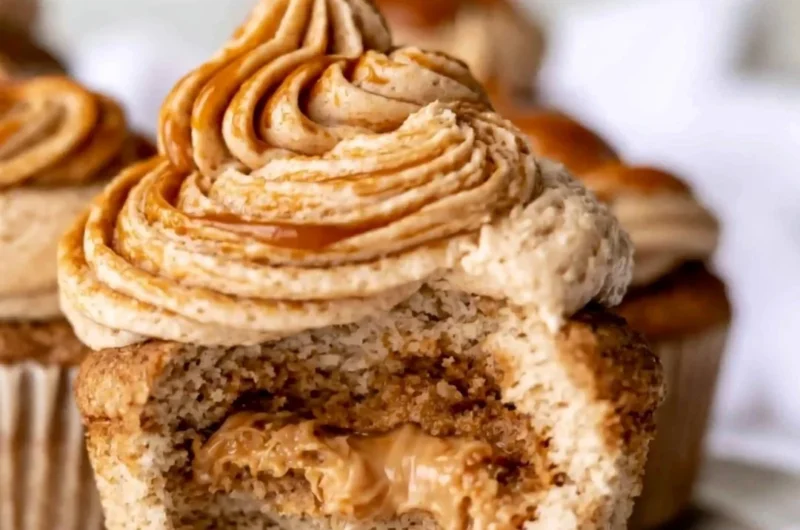 Homemade dulce de leche cupcakes with caramel frosting and toppings.