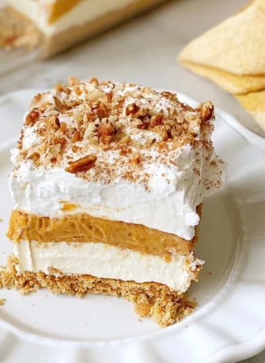 Delicious Pumpkin Lush dessert with creamy layers and fall decorations.