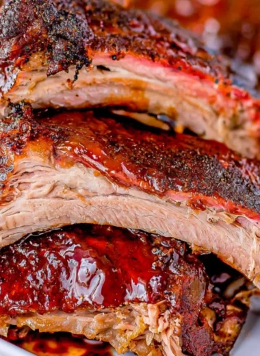 Mouthwatering smoked ribs served with barbecue sauce and sides.