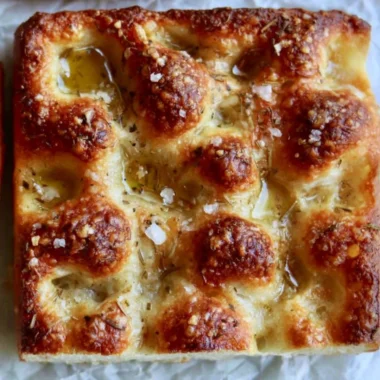 Freshly baked sourdough discard focaccia with herbs and olive oil