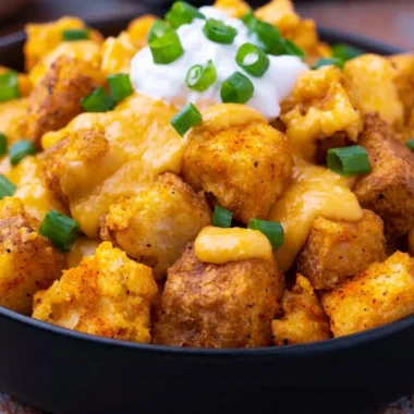 Taco Bell Fiesta Potatoes served in a bowl with toppings.