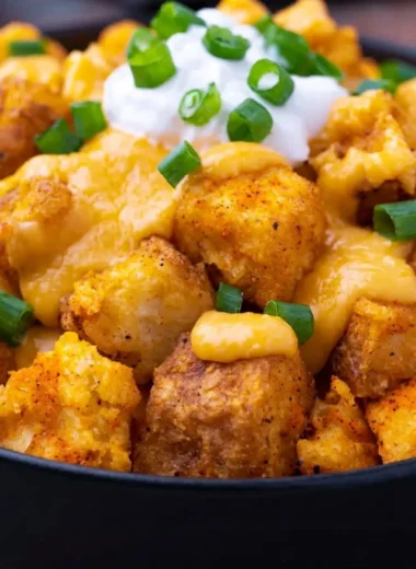 Taco Bell Fiesta Potatoes served in a bowl with toppings.